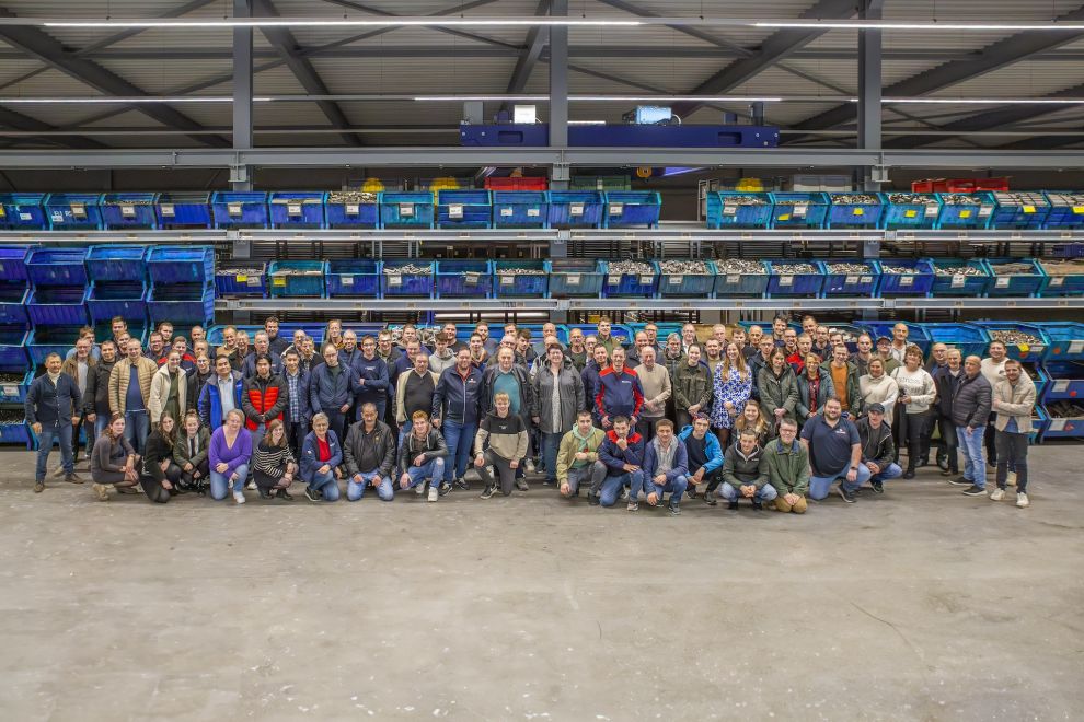 Groepsfoto van het personeel van het bedrijf Banner Werken bij en Studenten
