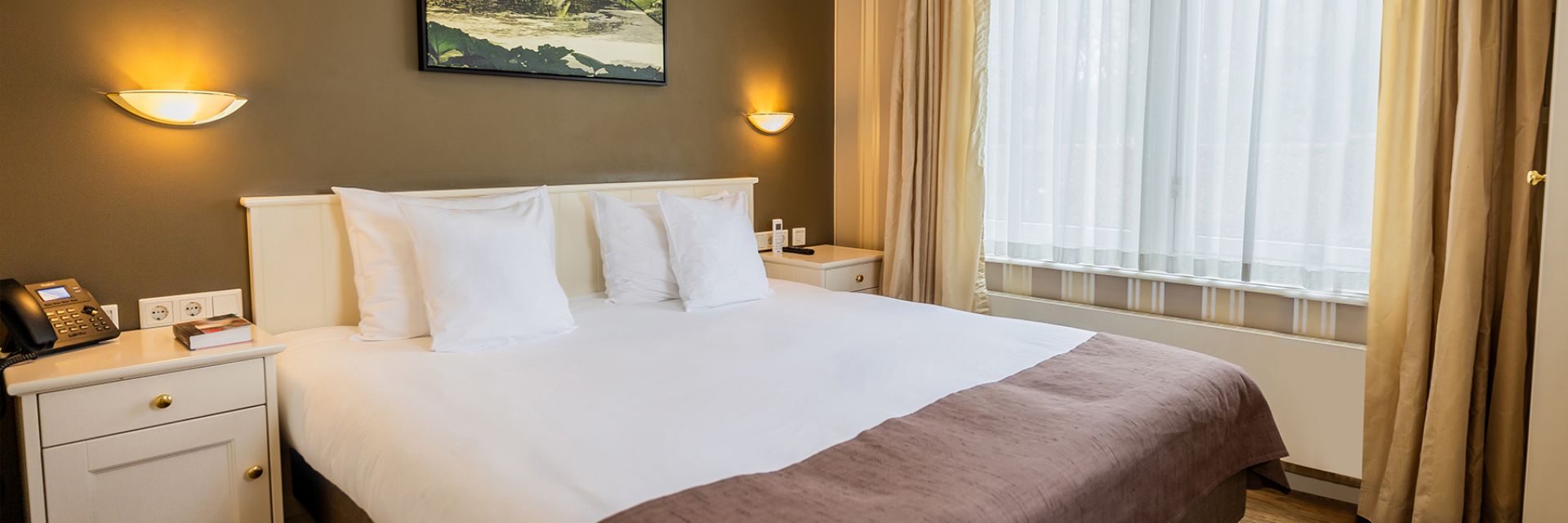 Header Deluxe king kamer bij Kasteel De Vanenburg hotel op de Veluwe