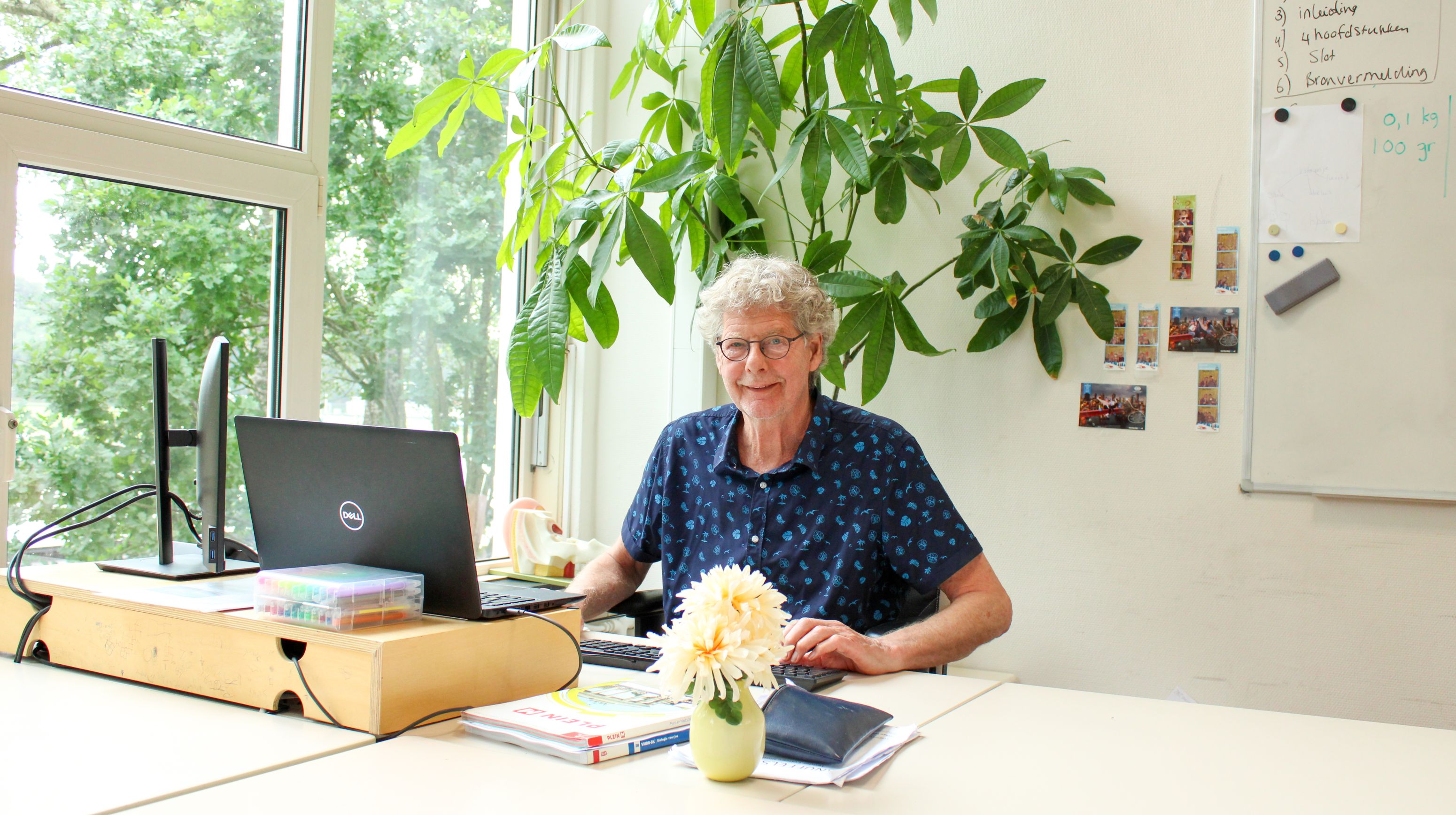 Docent achter laptop