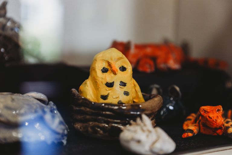 A display of handmade ceramic figurines A display of handmade ceramic figurines
