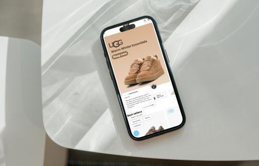 mockuuups-iphone-15-pro-mockup-on-a-white-modern-table