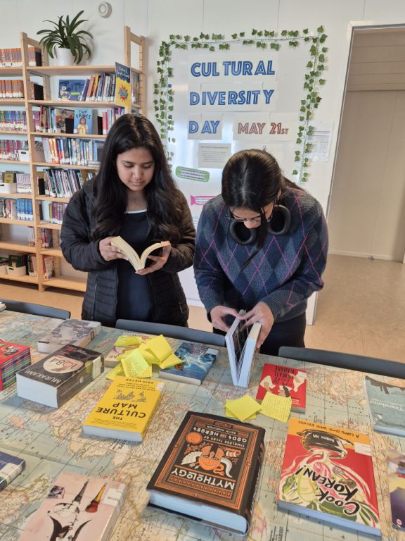 Secondary students browsing books in the library celebrating cultural diversity day