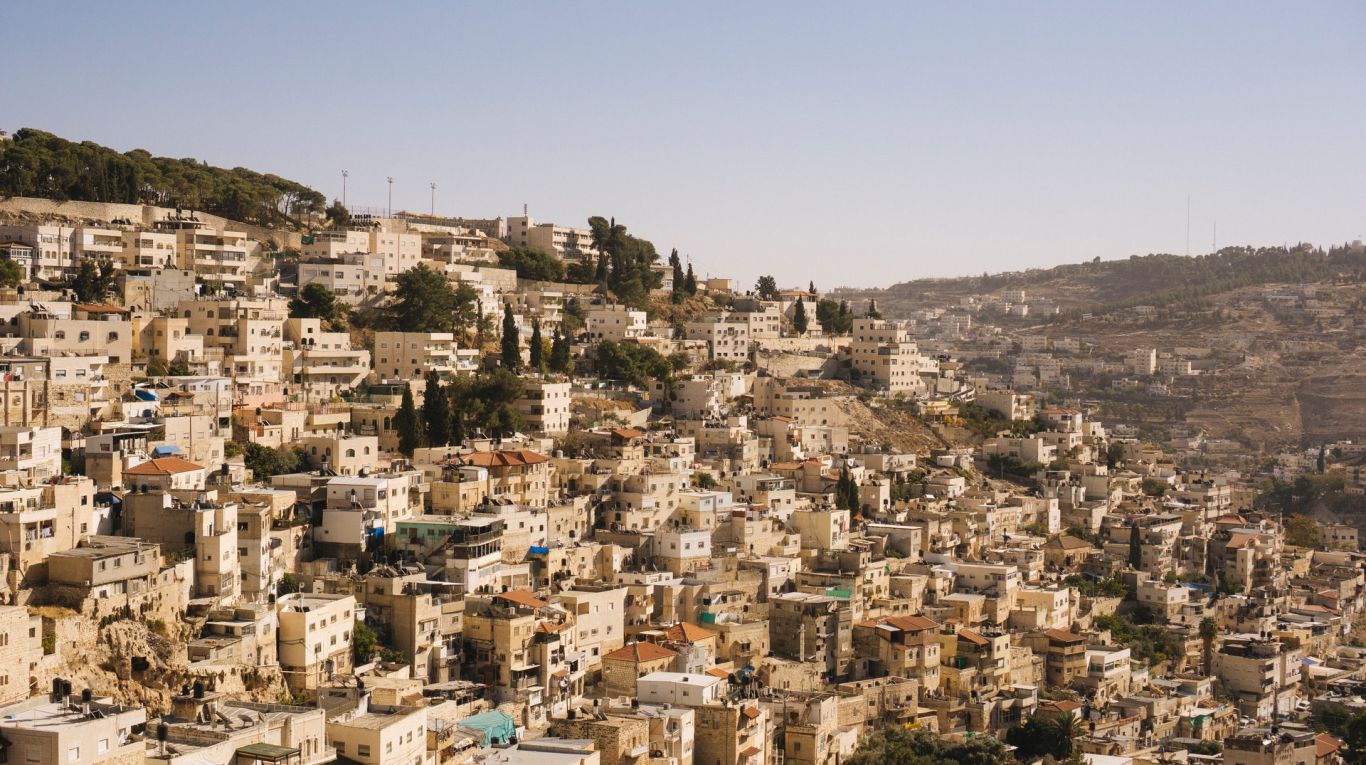 beige-concrete-buildings-on-high-ground-2087392
